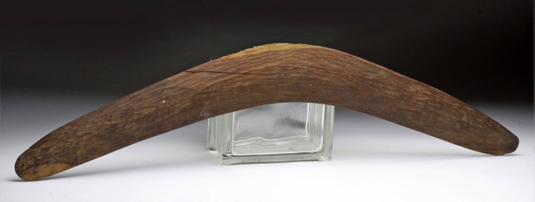 Early Aboriginal Wood Boomerang: Australia, end of 19th / first decade of 20th century CE. A large and superbly decorated boomerang (or throwing stick as this one was not designed to return on its own) of heavy hardwood, carved on ea
