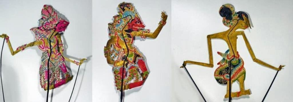 Lot of 3 Antique Indonesian Stick Puppets: Indonesia, 20th Century. A set of three Javanese Wayang polychrome stick puppets with fine detailing and exquisite color. Set contains a golden puppet of Batara Guru and two of her enemies. Such puppe