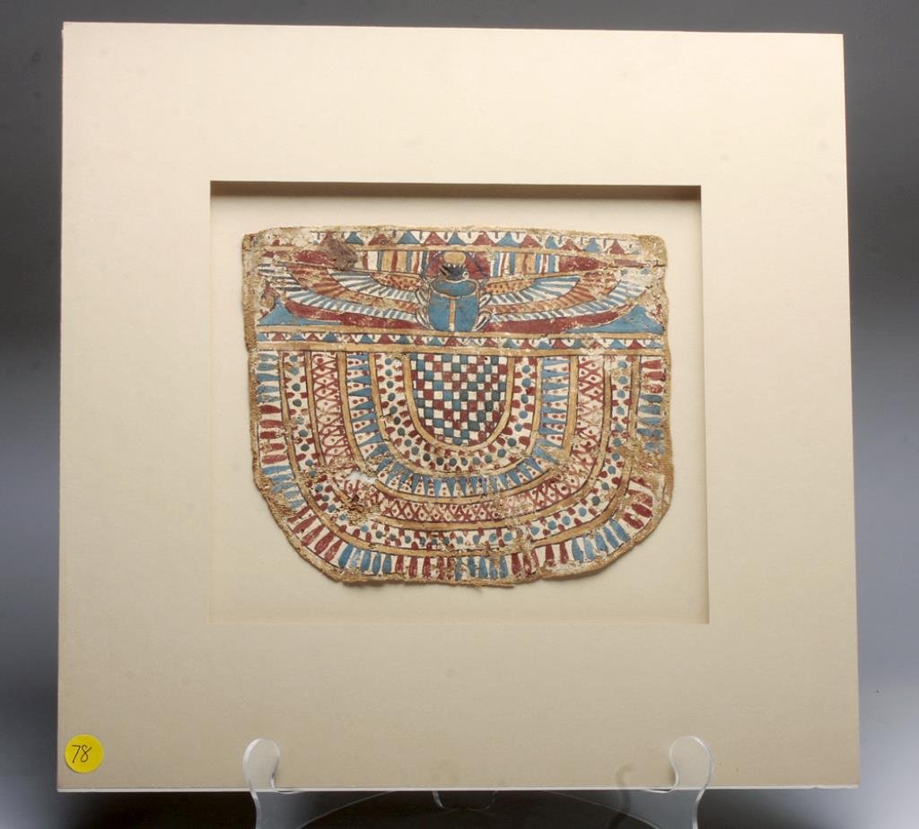 Egyptian Cartonnage Panel - Winged Scarab: Egypt, Ptolemaic Period, ca. 4th - 1st century BCE. A wonderful polychrome cartonnage pectoral, composed of linen and gesso, with beautiful hints of blue, red, white, black and gold. The winged scarab