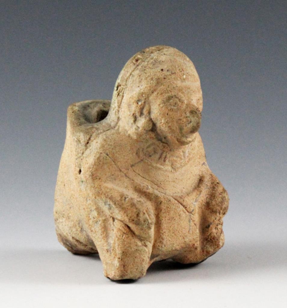 Pre-Columbian Tumaco La Tolita Figure: From the ancient Tumaco / La Tolita cultures of Ecuador/Colombia, ca 300 BCE - 300 CE. Near-miniature in size, measuring ~3" tall x ~2 1/2" deep. It depicts a seated or crouching individual, wearing a