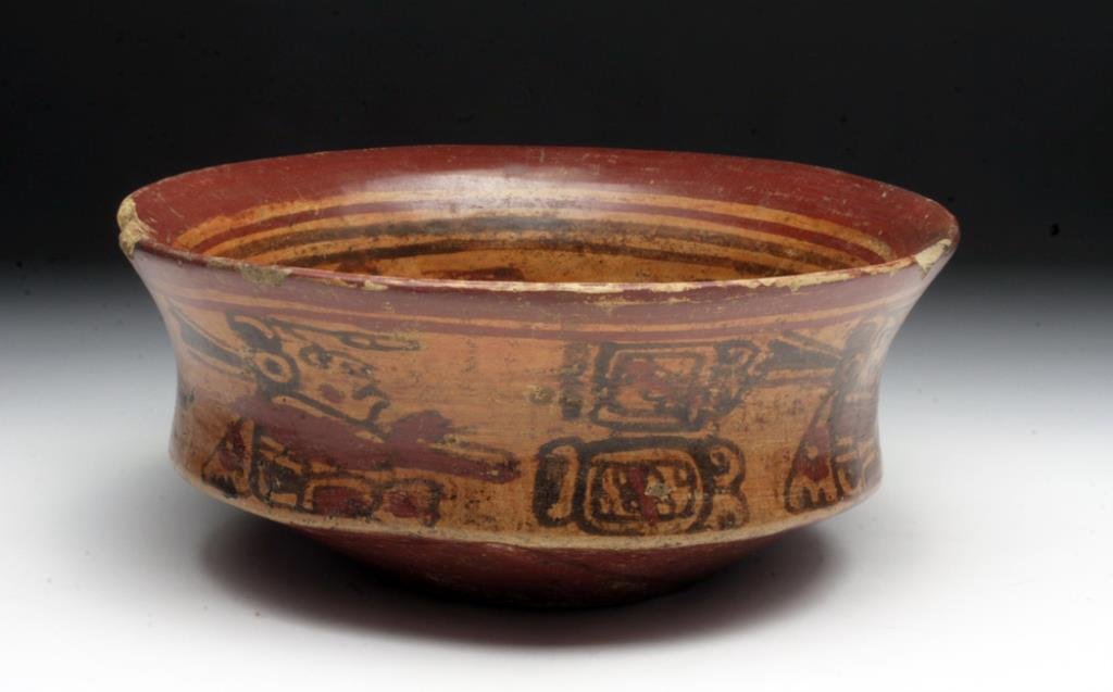 Mayan Copador Bowl - JAL / Mat Sign: Pre-Columbian, Mayan territories, ca. 600 to 900 CE. This handsome, hand built bowl is rich for its iconography painted in deep red and brown slip on a cream ground. The interior features a large JAL 