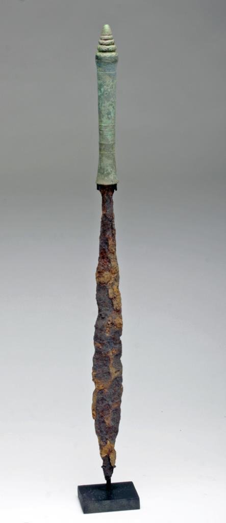 Cambodian Bronze and Iron Sword: Southeast Asia, Cambodia, Khmer Dynasty, ca. 12th century CE. An effective stabbing weapon, with a long, double-edged iron blade; with ornately incised bronze handle. The Khmer are the ancient inhabit