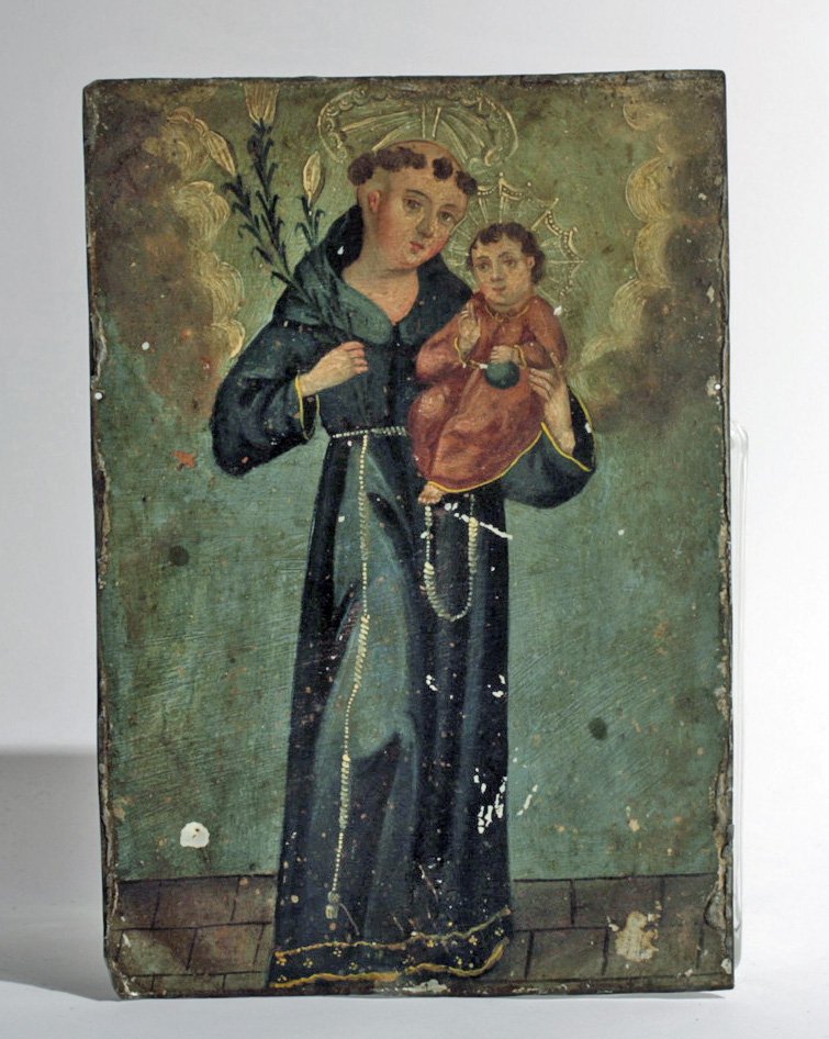 Antique Mexican Retablo - St. Anthony of Padua: Mexico, ca. 1800-1900. A fine antique Mexican retablo depicting St. Anthony of Padua holding the Baby Jesus. Icons like these were placed above household altars to venerate the saints (retablo literal