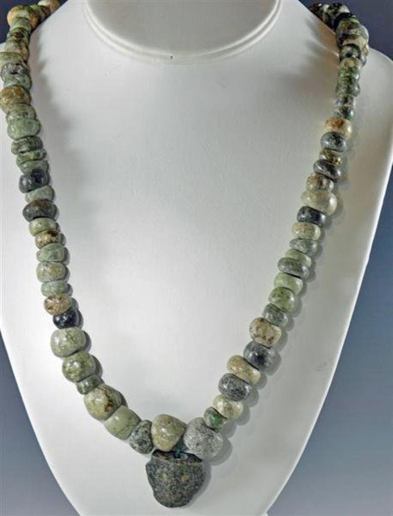 Guerrero Green/Brown Stone Bead Necklace with Pendant: Pre-Columbian, from Southern Mexico, Guerrero, Ca 500 BC. Nice long strand of green and brown stone beads, perhaps varieties of diorite, metadiorite, and porphyry, with lively markings accented in cen