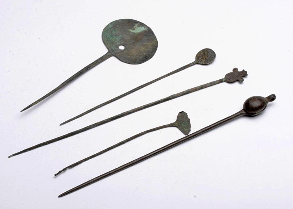 Lot of 5 Chimu Copper Tupu Cloak Pins: Pre-Columbian, Peru, Moche Valley, Chimu, ca. 1000-1400CE. The Chimu were master metal artisans as is evident in the fine detail of these tupus or cloak pins used by the Chancay and the Chimu of Pre-C