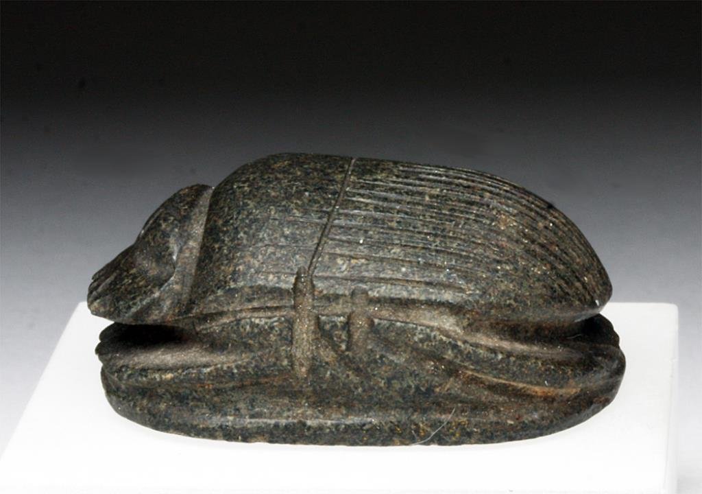 Egyptian Granite Heart Scarab: Egypt, Late Period, ca. 664-525 BCE. A beautifully carved stone scarab with incised detail on back, face, rear, and legs. Smooth bottom. 1-1/2"L x 1-1/4"W. Provenance: Ex-Private Boulder, CO Collectio