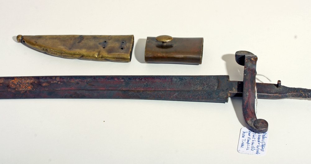 Civil War Bayonet with Makers Mark: American Civil War, Ca. 1861-1865 CE. An antique Civil War era iron bayonet from a rifle. Cast iron with long blade, central "blood ridge," hilt, and tang. Crown maker's mark stamped on blade and guar