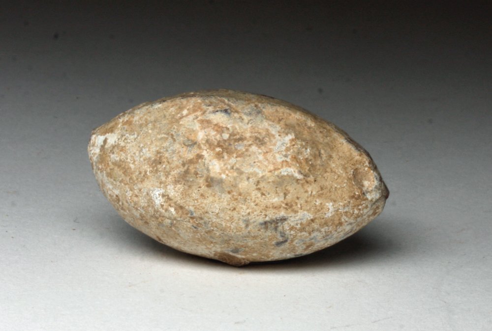 Very Large/Heavy Roman Lead Sling-Shot Bullet: Roman Empire, Ca 0 to 200 CE. Very large and lethal lead sling shot projectile. Used with deadly accuracy by the Roman legion. 1-1/2" L. Provenance: Ex-private Chicago, IL Collection, acquired before 
