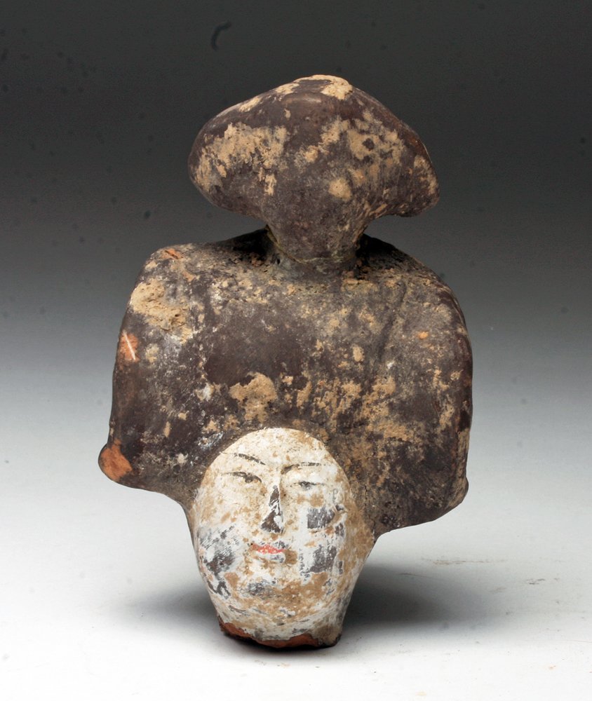Chinese Han Dynasty Female Head: China, Han Dynasty, Ca 221 BCE to 200 CE. Portion of statuette showing just the remaining head. With elaborate coiffure, and original pigments. 4-1/8"T. . Provenance: Ex-Sarkisian estate, Denver, CO, 