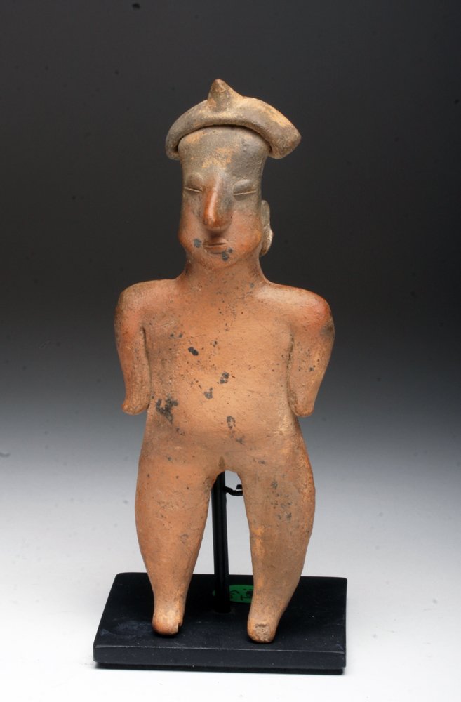 Colima Pottery Flat - Nude Woman: Pre-Columbian, West Mexico, Colima region, Ca 200 BCE to 200 CE. Pottery standing female, shown nude, legs slightly apart, arms at her sides, coffee bean eyes shown closed. 6-3/4" h. Provenance: Ex-pr