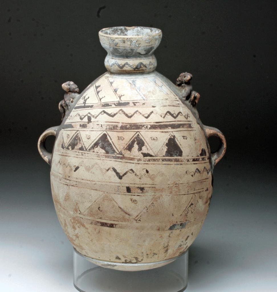 Pre-Columbian Chancay Olla w/ Monkeys: Central Peru, Chancay culture, ca 1000 to 1200 CE. Terracotta amphora of bulbous form painted in geometric patterns in brown over white, monkeys resting just above each handle. 10-3/4" H. Provenance: