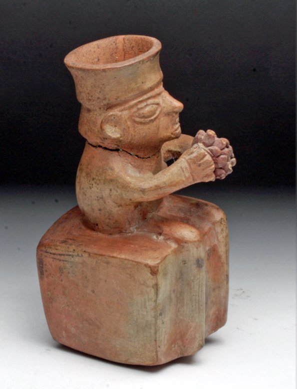 Inca Effigy Vessel Holding Spondylus Shell Jar: Pre-Columbian, Peru, Central Coast, ca. 1300 to 1500 CE. This effigy bottle is composed of a seated male figure dangling his legs over one end of the bottle, holding a Spondylus shell in his hands - p