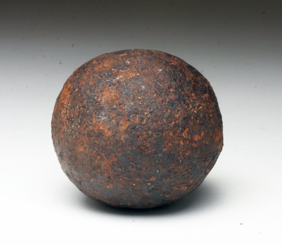 1770s American Revolution Iron Cannon Ball: United States, Pennsylvania, ca. 1770s. An iron cannon ball, likely part of a scatter shot/grape shot in which multiple iron balls would be loaded into a cannon and fired simultaneously. 2-1/4"D. Cust