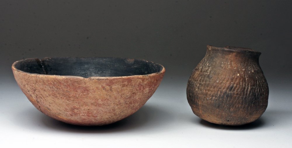 Lot of 2 Native American Mogollon Corrugated Pottery: West central New Mexico, Ca 1200 to 1350 CE. Pair of utilitarian pottery pieces, each with red base clay with heavy black and gray firing clouds and each "corrugated" using stick impressions. 7" D for