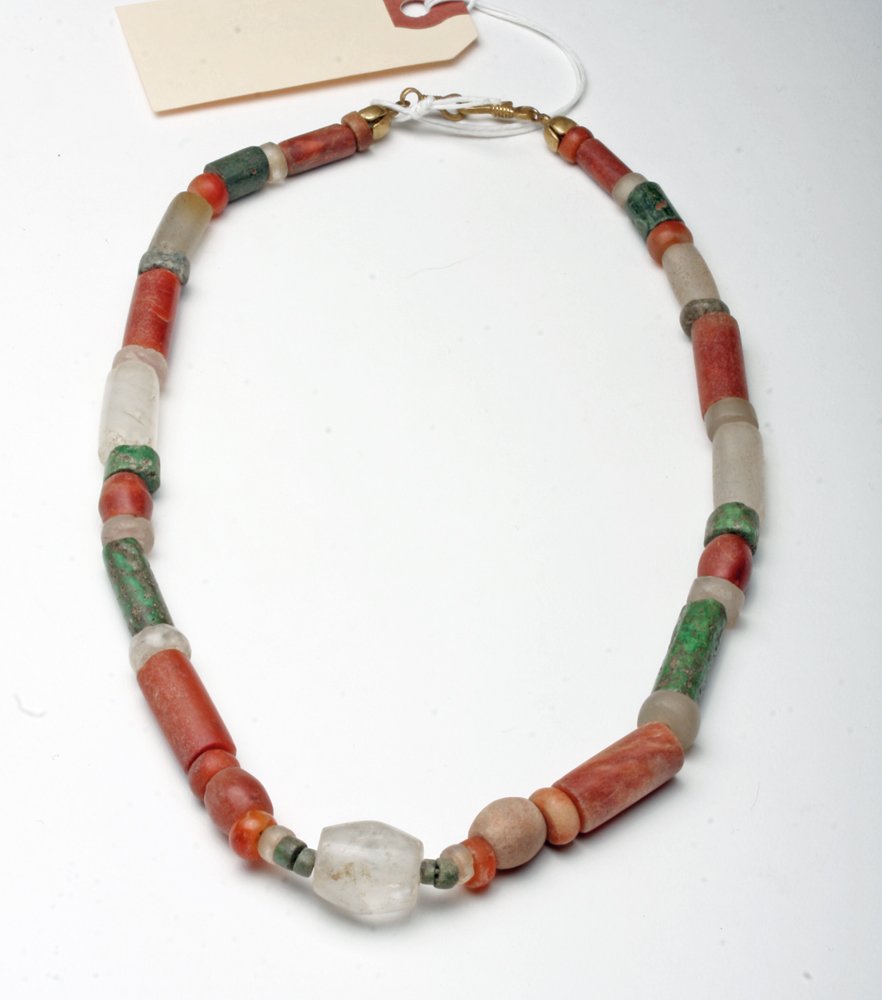 Tairona Necklace - Carnelian, White Quartzite, and: Pre-Columbian, Colombia, Ca 1000 to 1500 CE. This attractive Tairona necklace is comprised of forty five beads in a variety of shapes - cylindrical, round, and lozenge - and stones - carnelian, white 