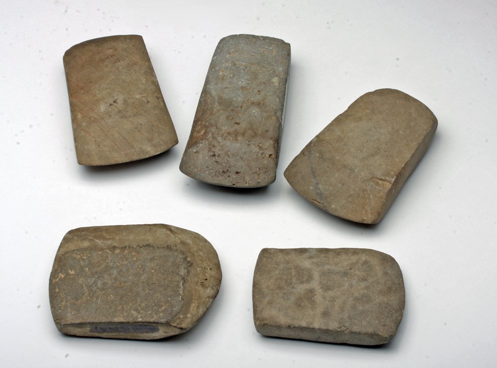 Lot of 5 Tairona Hand-Carved Stone Celts: Pre-Columbian, Colombia, Taiorona culture, ca. 1000-1500 CE. Lovely ensemble of hand-carved stone celts, all with sharp chiseled edges, skillfully created by the artisans of the Tairona culture of Col