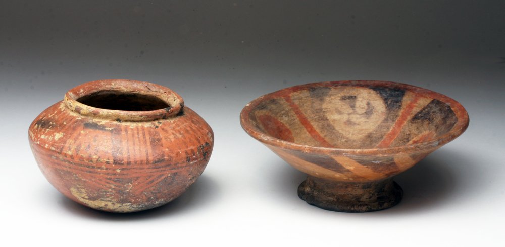 Lot of 2 Narino / Carchi Pottery Vessels: Pre-Columbian, Colombia, Narino/Carchi, ca. 800-1200 CE. Striking pair of Narino vessels, including a small bichrome red and black olla with geometric decoration complemented by a red, black, and crea