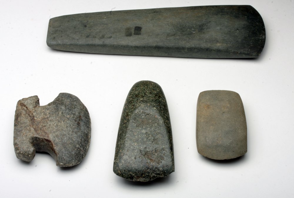 Lot of 4 Stone Celts - Tairona and Chimbopozo: Pre-Columbian Americas, Colombia, Tairona culture and Ecuador, Ca 1000 to 1500 CE. Four stone cults, including a pair from the Chimbopozo Province of Ecuador with wonderfully contrasting shapes and hu