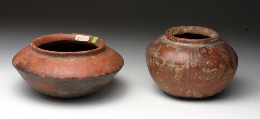Lot of 2 Narino / Carchi Hand built Pottery Ollas: Pre-Columbian, Border Ecuador/Colombia, Karchi culture and Narino culture, ca. 800-1500 CE. Two expertly handbuilt vessels, skillfully decorated with the negative-resist technique in black and iron ri