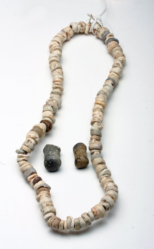 Jalisco Stone Bead Necklace + Pair Ear / Nose Ornaments: Pre-Columbian, West Mexico, Jalisco culture. Ca. 0-200 CE. This strand of larger, carved stone disk beads was created by the Jalisco culture on the West coast of Mexico. It comes to us from a major Pr