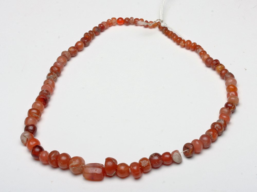 Ancient Roman Necklace, Carnelian Beads: Rome, ca. 1st Century CE. A fine necklace composed of hand carved carnelian beads. Each bead is unique in shape, size, and hue. Such an interesting piece of wearable history! 17" Provenance: ex-Gilber