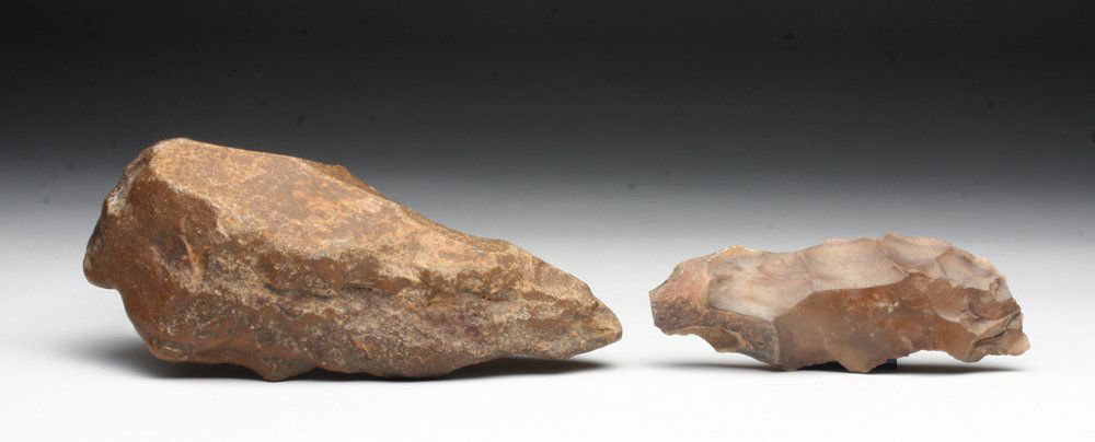 Pair of Achulean Hand Axes: Europe, Achulean Period, ca 1.7 million years ago. A pair of carved stone tools, likely used as axes or hoes, of beautiful golden/red stone. 3"W & 4-1/4"W. Provenance: Ex-Connell Collection, MA. All i