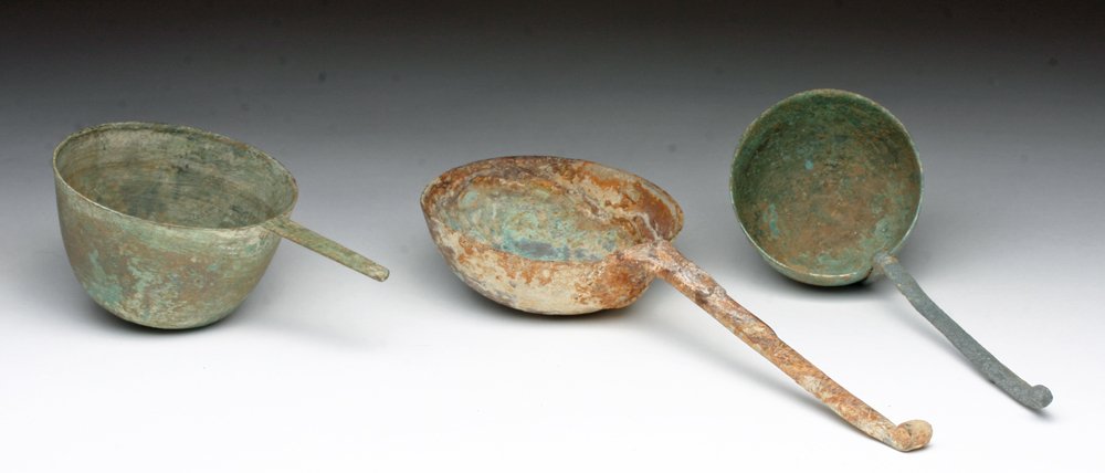 Lot of 3 Thai, Cambodian Bronze Ladles: Cambodia, ca. 10th - 14th century CE; Thailand, Ban Chiang 300 BCE - 200 CE . A set of three cast bronze ladles with large bowls and handles. Longest ladle is from the Ban Chiang culture, has high cop