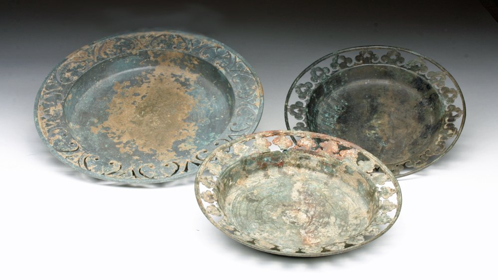 Lot of 3 Khmer Bronze Openwork Plates: Cambodia, Khmer, ca. 12th - 14th century CE. A set of three bronze plates with floral openwork rims. 6-1/4" and 7-7/8"D. Provenance: Ex-private San Diego, CA Collection. All items legal to buy/sell un