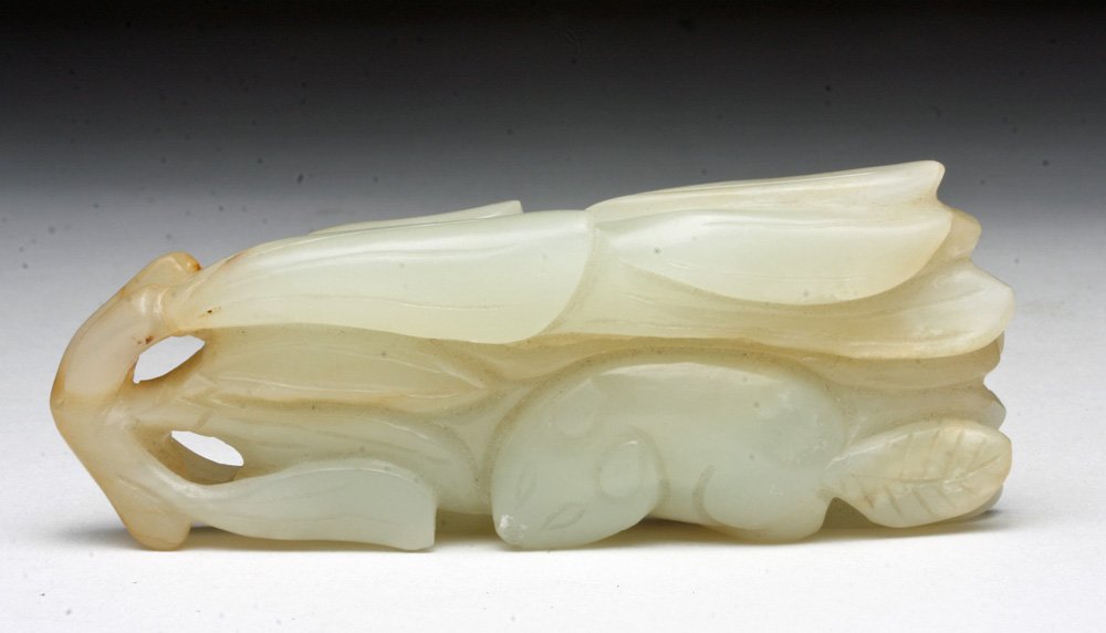 Chinese Qing Dynasty White Jade Carving, Beaver: China, Qing Dynasty, ca. 1850. A lovely little pendant carved from white jade. A beaver, sweetly rendered, in a group of leaves. Spacing at top allows for use as a pendant. 3" Provenance: ex-Sarkisian
