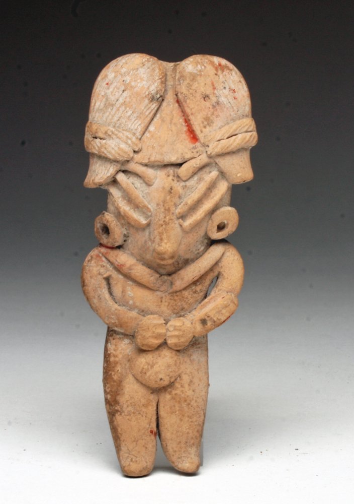 Pre-Columbian Chupicuaro Pretty Lady: Guanajuato Valley, Mexico, ca 300-100 BCE. Lovely terracotta "pretty lady" flat figure. Holding hands to her protruding belly, this female (who is perhaps pregnant) dons a fanciful coiffure characteri