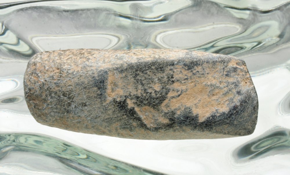 Indo-Chinese Neolithic Stone Tool - Ex Herrington Coll: Indo-China, Neolithic Period, ca. 4000 BCE. A carved stone axe with long body and single cutting blade on front. 4"L. Provenance: Ex-Connell Collection, MA; ex Herrington collection, NZ. All items leg