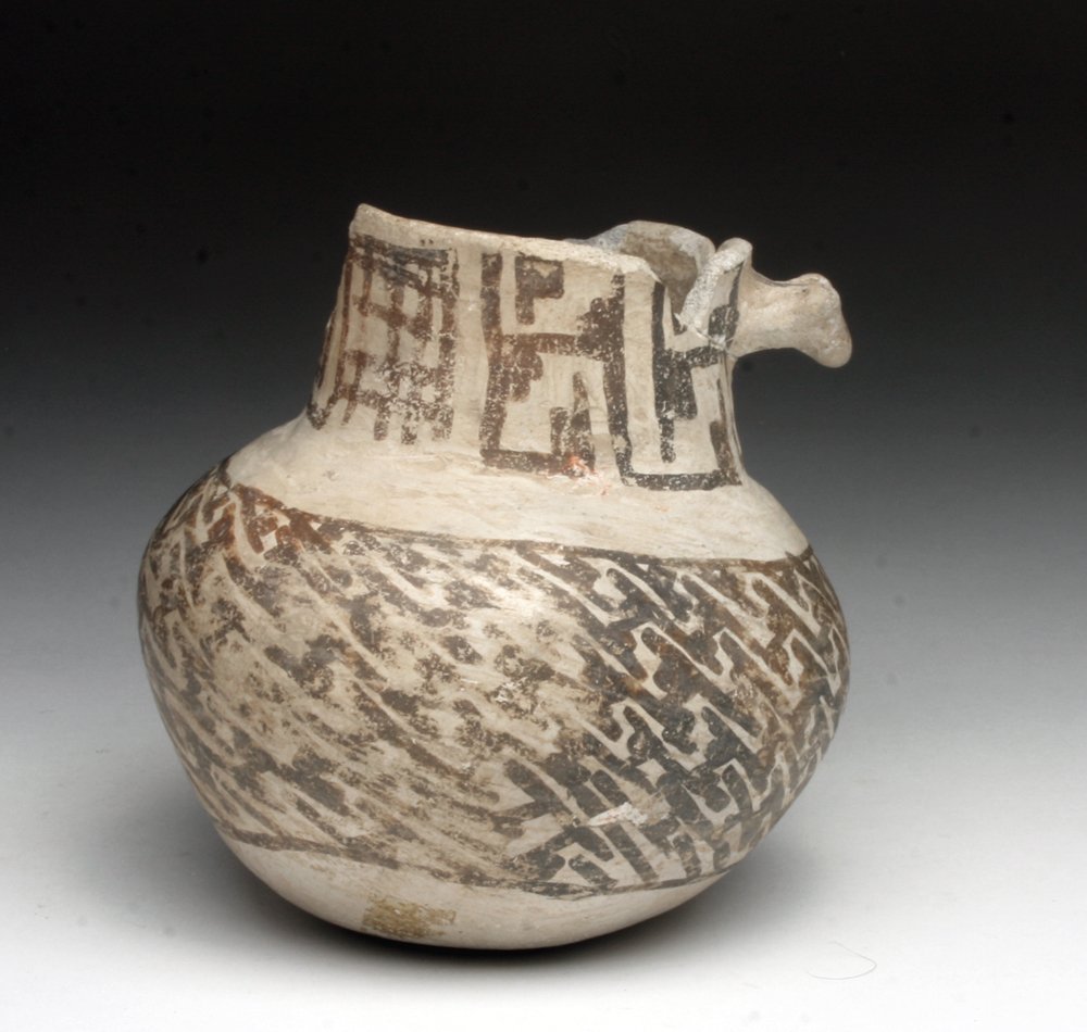 Prehistoric Anasazi Black-on-White Pottery Pitcher: Native American, North America, New Mexico, Arizona and Northern Mexico, Mogollon, Anasazi Culture, ca. 1100-1200. Mogollon pottery was created with iron-rich volcanic clays which fire to dark brown u