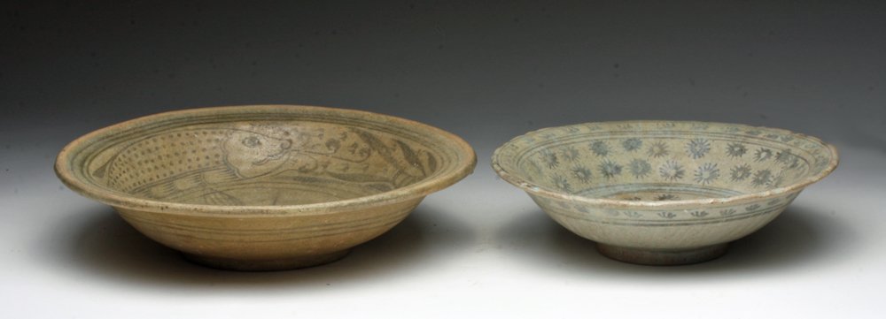 Lot of 2 Thai Sukhothai Glazed Bowls: Thailand, Sukothai, ca. 15th century CE. Two ceramic glazed bowls, one a fish bowl with four firing marks on center around a blue painted fish, second a bowl with painted floral design around exterior
