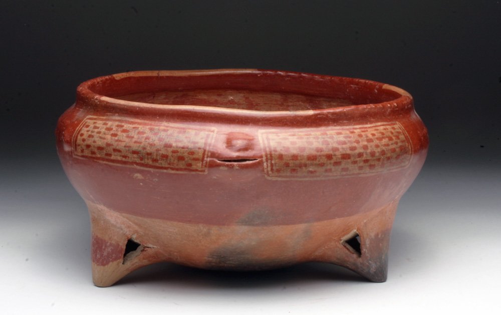 Chupicuaro Redware Tripod w/ Face: West Mexico, Guanajuato Valley, Ca 200 BCE. A very large pottery tripod decorated with white over red geometric checkerboard pattern small face emerging from one side of the bowl, three rattle-legs be