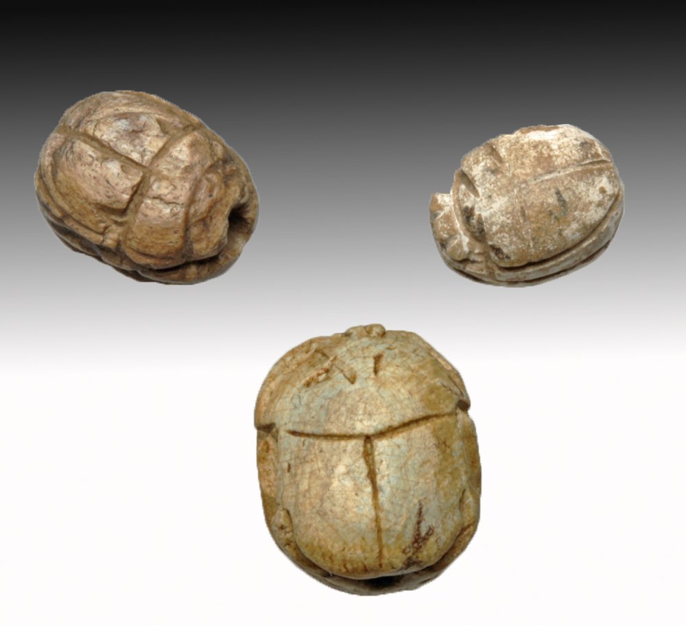 Lot of 3 Early Egyptian Steatite Scarabs: Egypt, Middle to New Kingdom, Ca 2055 to 1544 BCE. Each scarab in typical beetle form, underside inscribed with symbols to offer wearer good fortune. Largest 14mm long. Provenance: Ex-M. Poolos collec