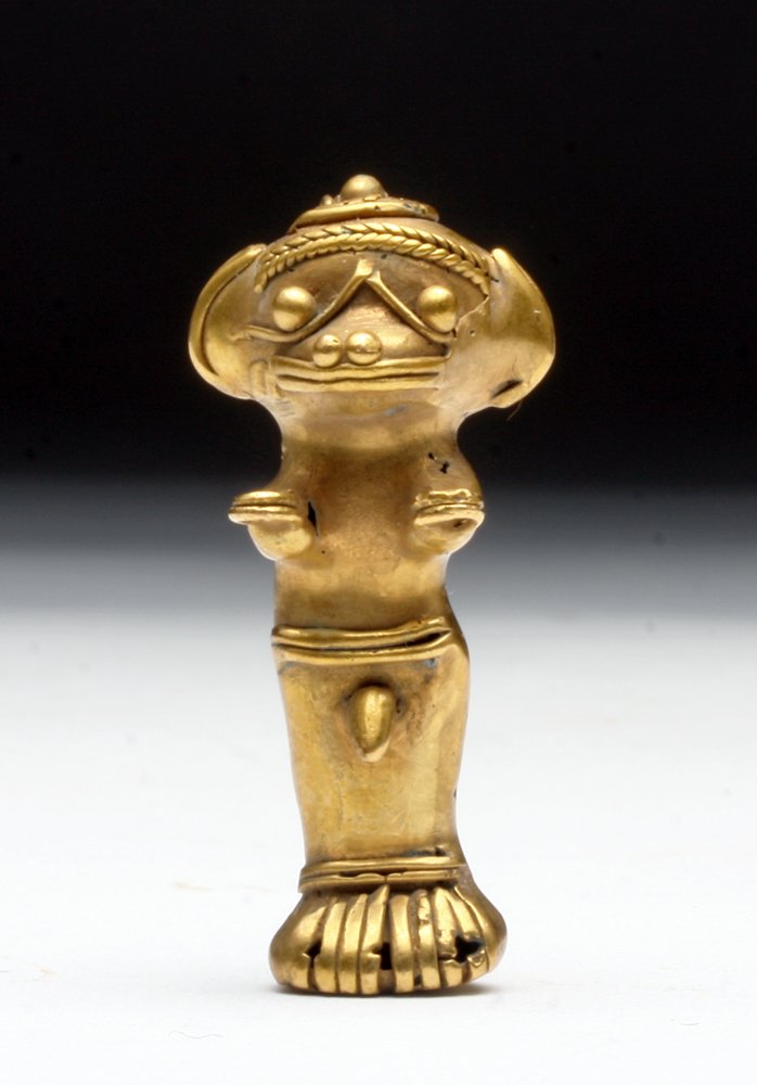 Pre-Columbian Tumbaga Standing Figure, 9.39g.: Colombia, Ca 1500 CE. Tumbaga - technique of creating combining gold and copper where gold "floats" to the top allowing the creation of beautiful gold items while using a minimum of gold. Standing fig