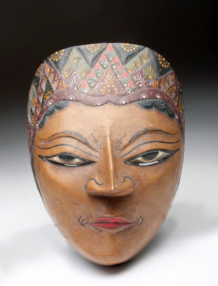 Vintage Javanese Dance Mask - Prince Panji: Java, Indonesia, 20th century. Striking carved wood mask with finely painted details representing Prince Panji, the legendary prince of East Java. Tales about the life of Prince Panji have inspired In