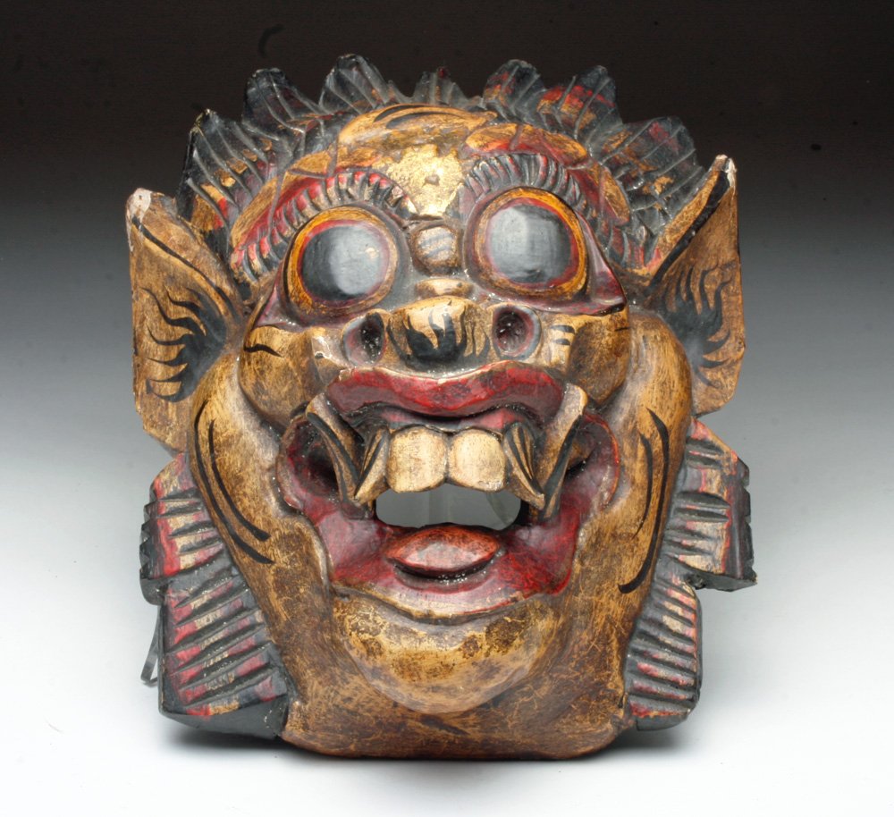 Vintage Balinese Barongan Mask: Bali, Indonesia, 20th century. Carved wood mask with expressive features and finely painted details used in the performance of the barong dance on the island of Bali in Indonesia. Barong is a lion-lik