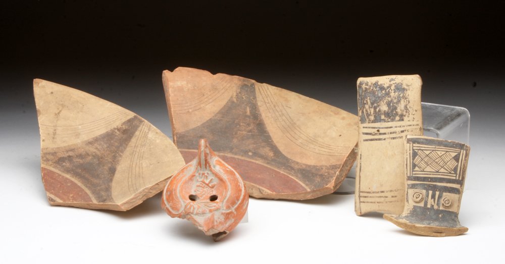 Lot of 5 South Italic Fragments, Ex-Farwell: Southern Italy, ca. 5th - 4th century BCE. A set of five south Italic fragments, including a large portion of a redware oil lamp depicting a king, two large fragments from a Daunian spittoon, with bla