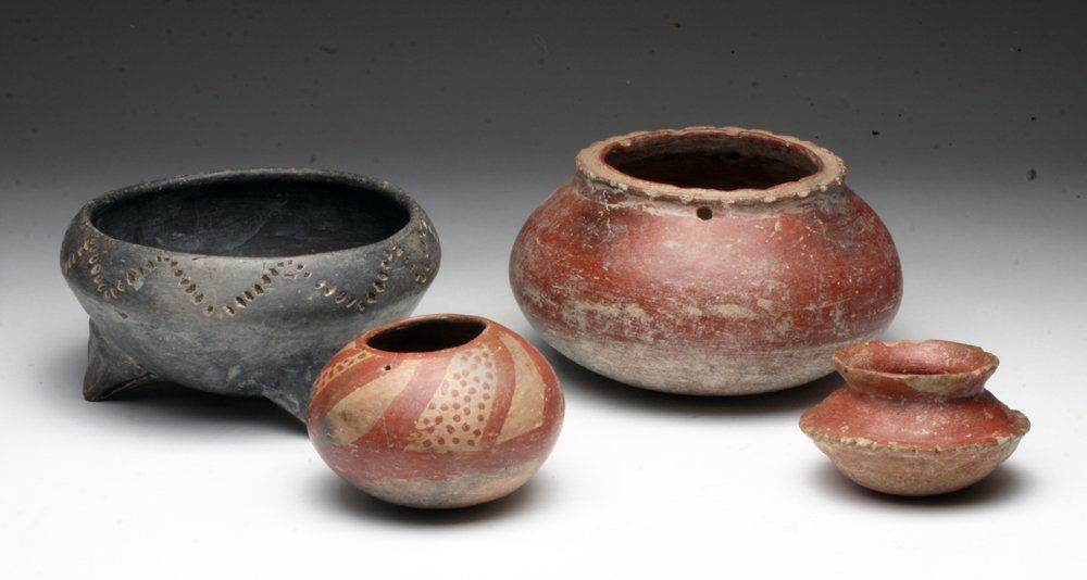 Group of Four Chupicuaro Ceramics: Pre-Columbian, Mexico, Guanajuato Valley, ca. 300-200 BCE. Witness the enormous variety of Chupicuaro ceramics in this single lot. We have blackware, redware, and bichrome finishes - not to mention th