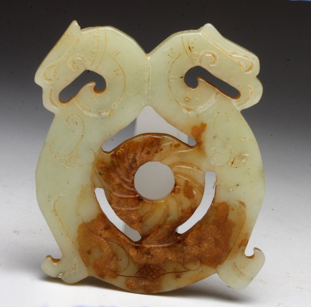 Chinese Jade Pendant, Double Bird Heads: China, Qing Dynasty to early Republic period, ca. 1900- 1925 CE. An elegant placque carved from "mutton fat" jade with opposing birds (phoenix perhaps?), each with incised decoration. A rounded "bi" i