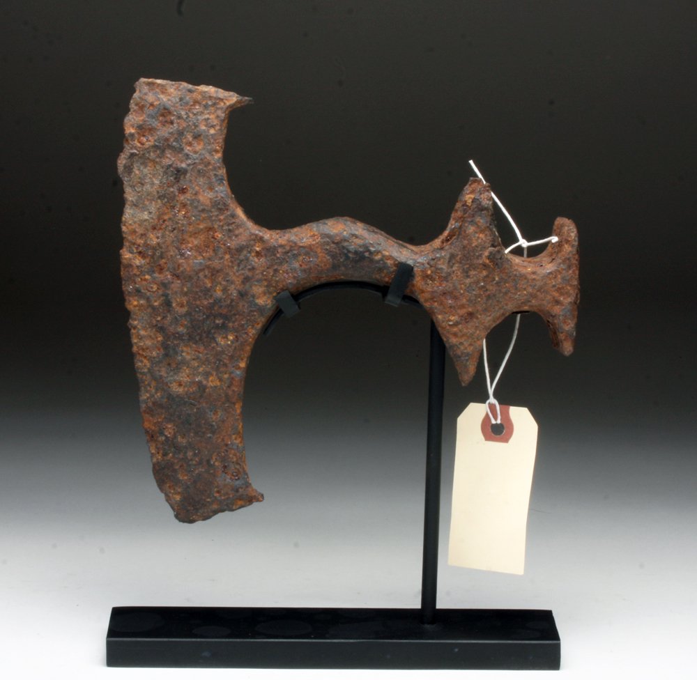 Superb Viking Iron Bearded Axe: Europe, Viking Culture, ca. 8th - 11th century CE. A magnificent iron axe with large near-crescent shaped blade, extending above and below the head shaft, with wings on the inside edges of both top an