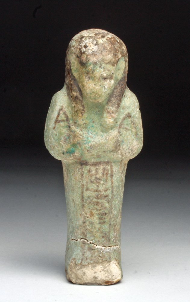 Larger Egyptian Faience Ushabti: Egypt, Late Dynastic Period, probably Dynasty 25, Ca760 to 656 BCE. Blue-green faience ushabti - servant to the dead in the afterlife - standing with arms to his chest holding crook and flail and seed