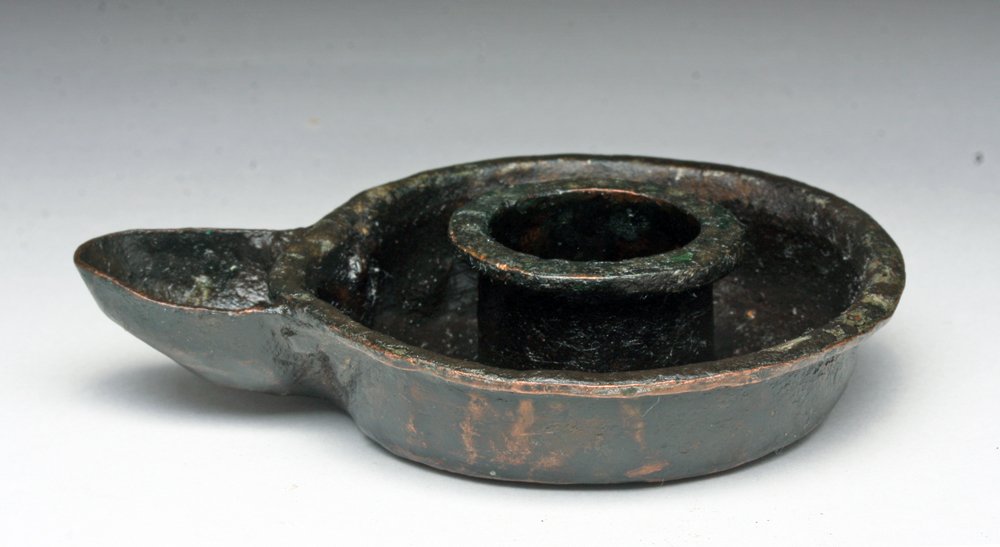 Late Roman Oil Lamp - Rare Form: Late Roman to Byzantine Bronze oil lamp, Ca 5th to 7th century CE. Circular oil lamp in darkened bronze, central circular well with outer oil pan and attached bronze spout. Rare form! 3-1/2" L. Proven