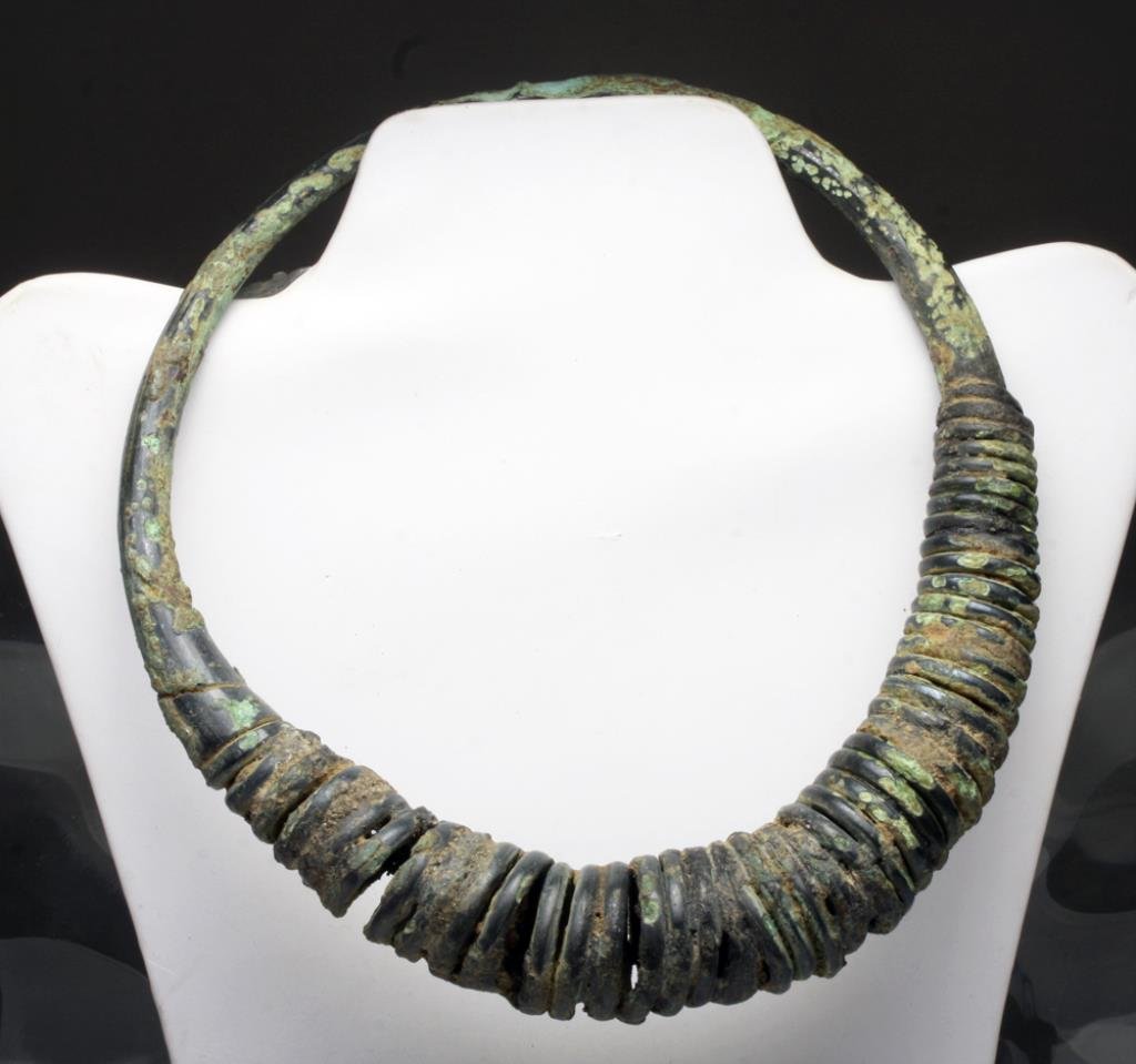 Large Khmer Bronze Torque: Cambodia, Khmer period, Ca 12th century CE. Wow! Large, very heavy solid bronze necklace, or torque, in thick bronze wire, lower half with wrapped coils of bronze in graduated sizes. What a spectacula