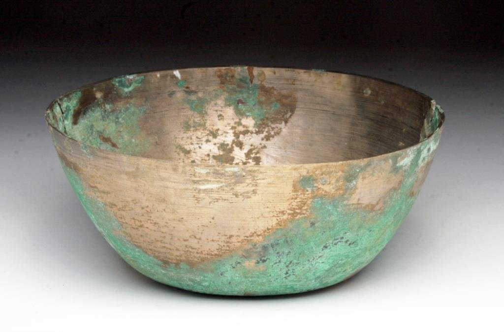 Khmer Silvered Bronze Bowl: Cambodia, Ca 12th to 14th centuries CE. Beautiful in its simplicity! Bronze bowl appearing more silver than bronze, exterior and interior heavily finished in silver wash and each side showing wheel cu