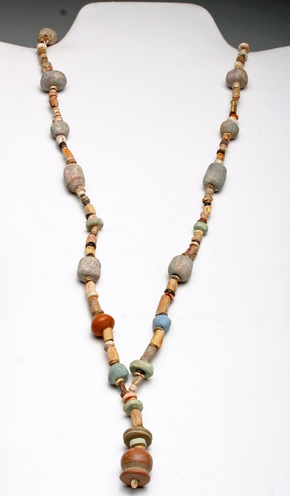 Chimu Stone, Pottery and Shell Necklace: Pre-Columbian, North Coast Peru, Ca 1100 to 1400 CE. Nice strand of ancient beads comprised of hand-drilled stone; carved shell and pottery beads. 31"L. Provenance: Ex V. Gamba collection acquired pri