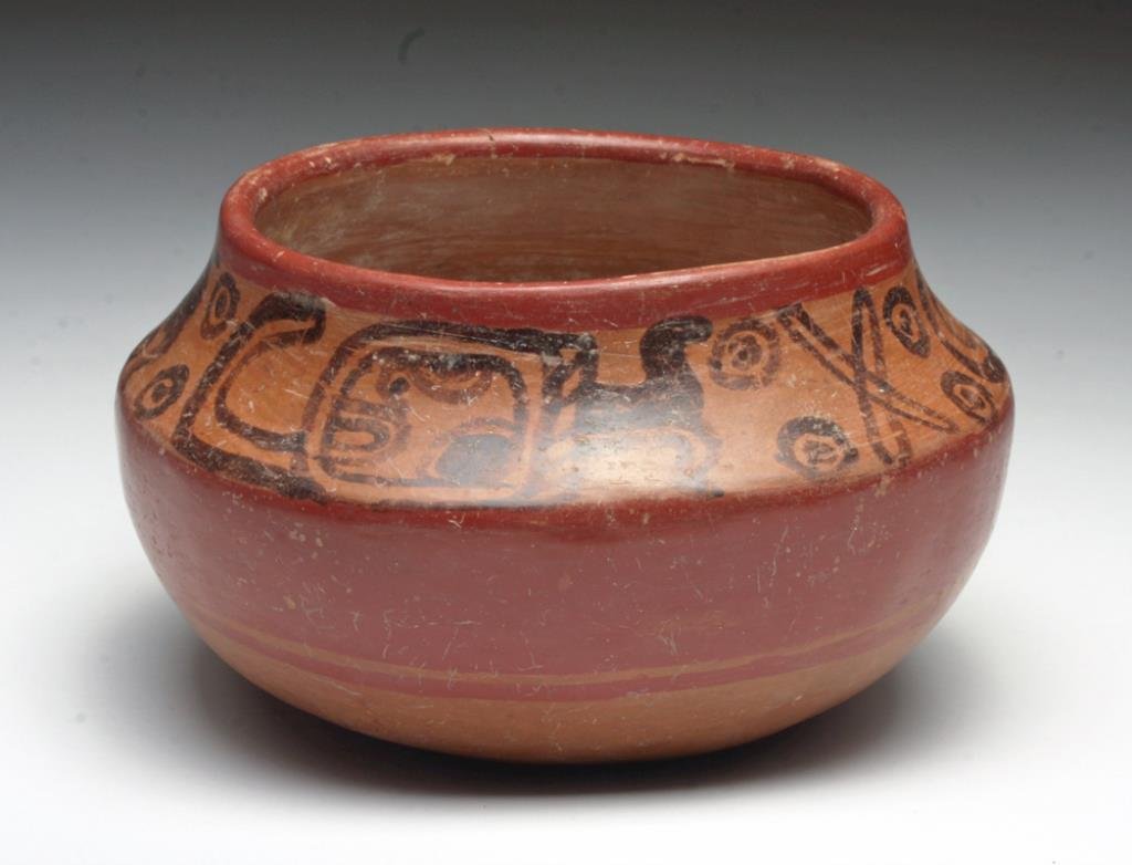 Pre-Columbian Mayan Copador Bowl: El Salvador, Mayan Territories, Ca 550 to 900 CE. Fine terracotta bowl, decorated with band of glyphoids along upper rim, included are Mat and Speaking glyphs. 3-3/4" H by 6-1/2" D. Provenance: Ex Gil