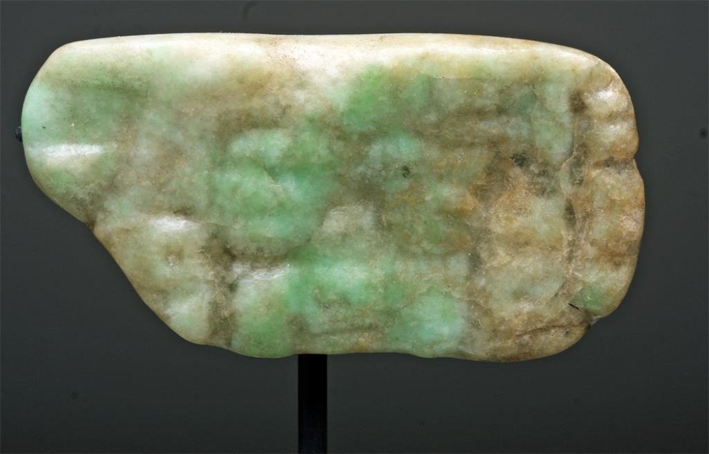 Mayan Jade Pendant - Human Head: Pre-Columbian, Mayan Territories, Classic Maya, Ca 500 to 850 CE. This impressive jade carved pendant seduces us with its pure, apple green color, the signature hue of Mayan jade. Look closely and you