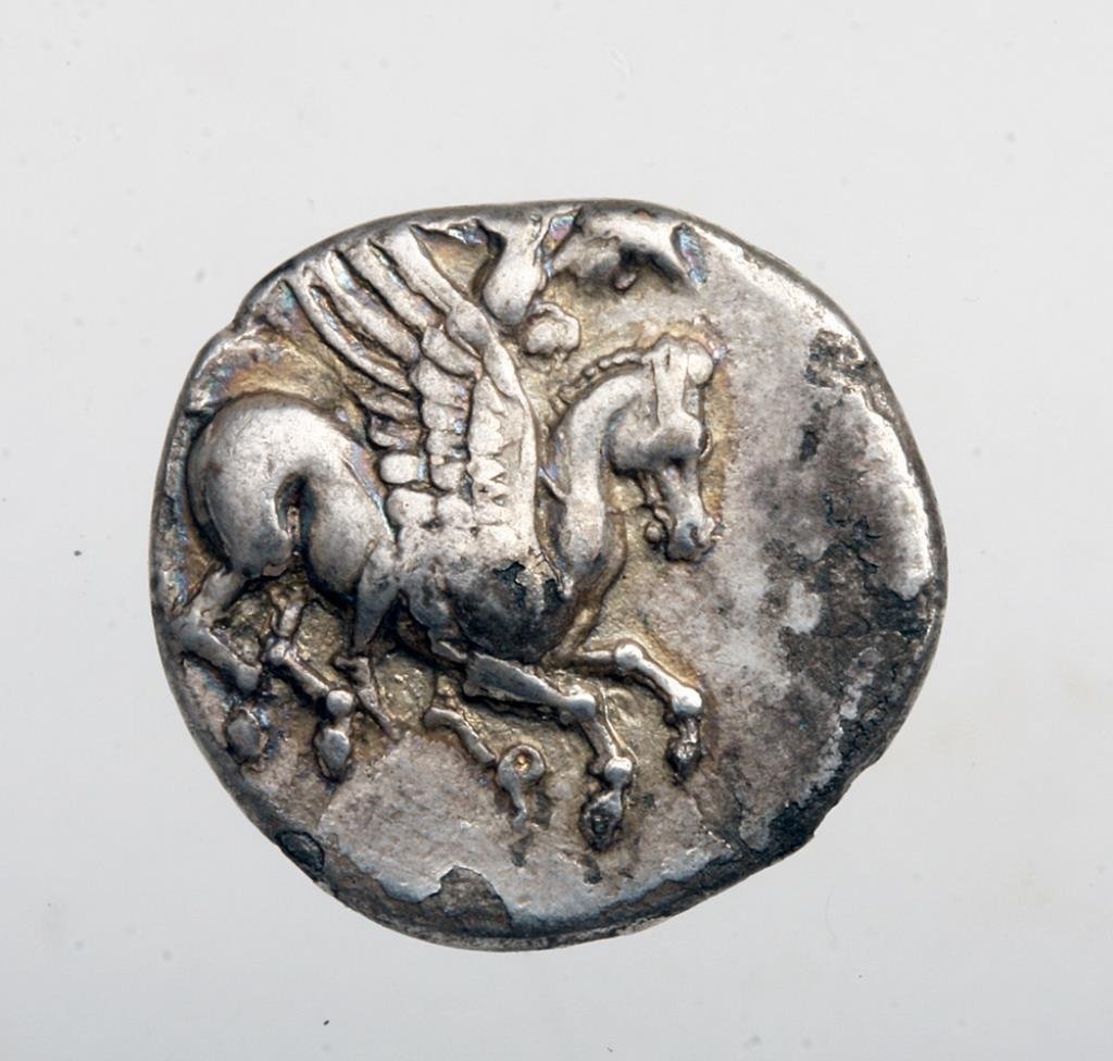 Rare Silver Greek Corinthian Coin - Pegasus & Chimaera: Corinth, Greece, 330 BCE. If you know Greek coinage then you know just how rare this variety is! In a denomination known as a trihemidrachm, this coin feaures Pegasus being riden by Bellerophon. On th